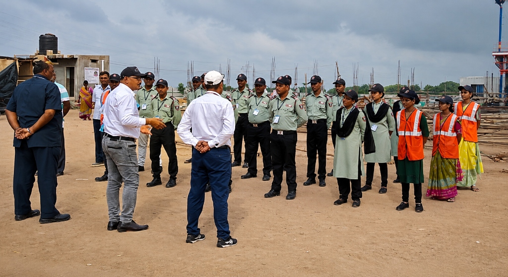 Security supervisors briefing personnel on-site during a shift alignment check